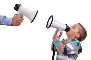 Father and son shouting at each other through megaphone